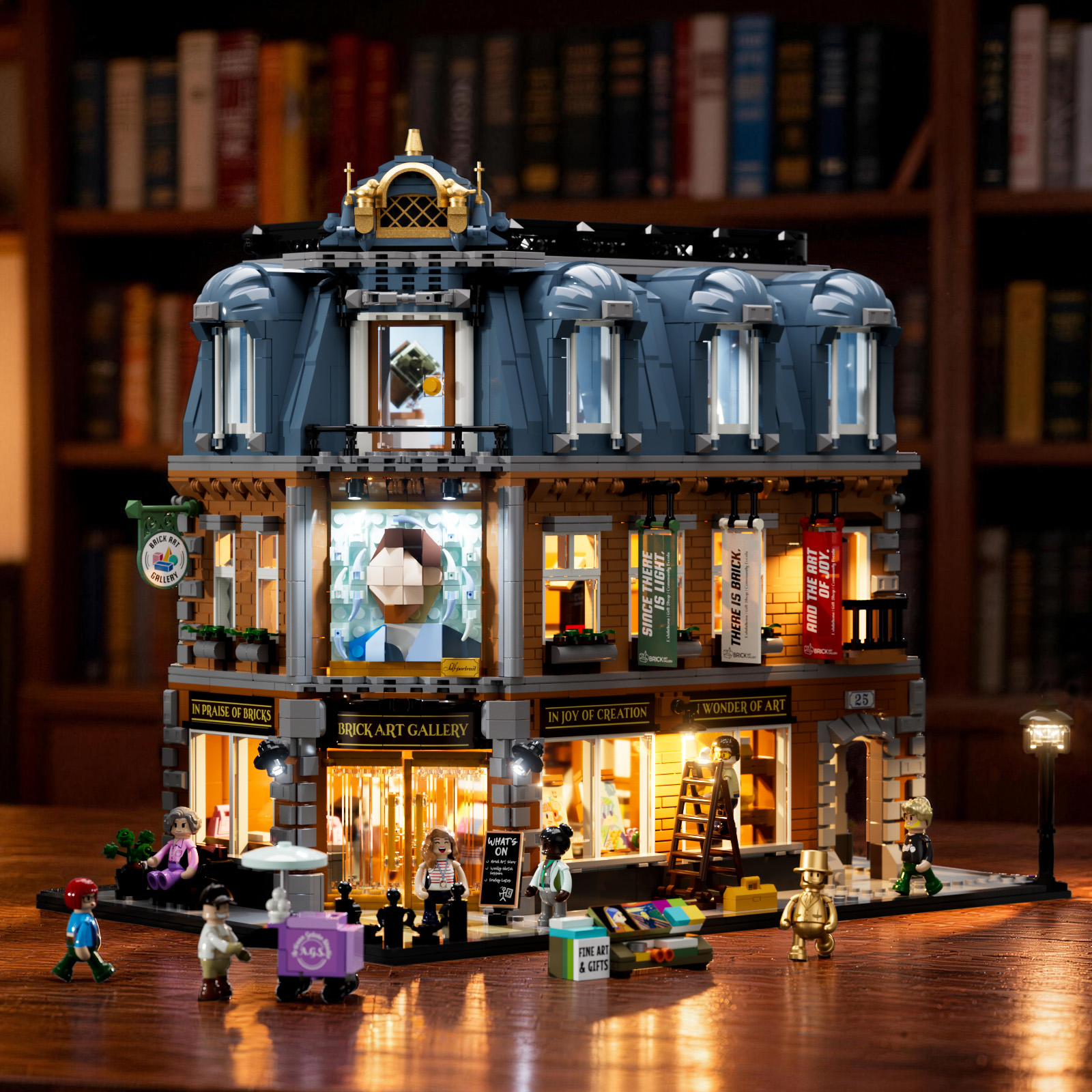 The same miniature streetscape with its windows warmly illuminated